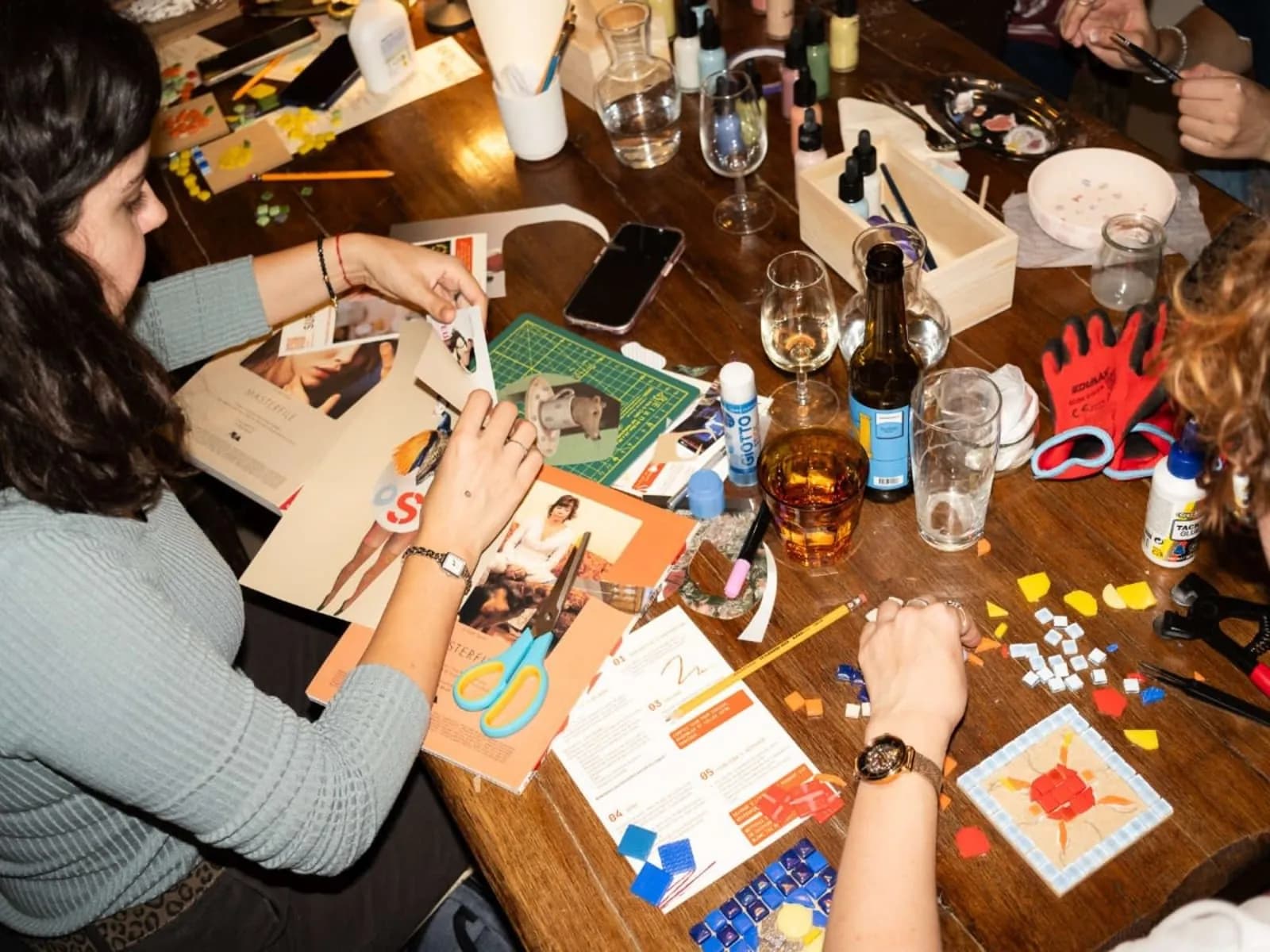 Colleagues creating artworks in an art café in Paris