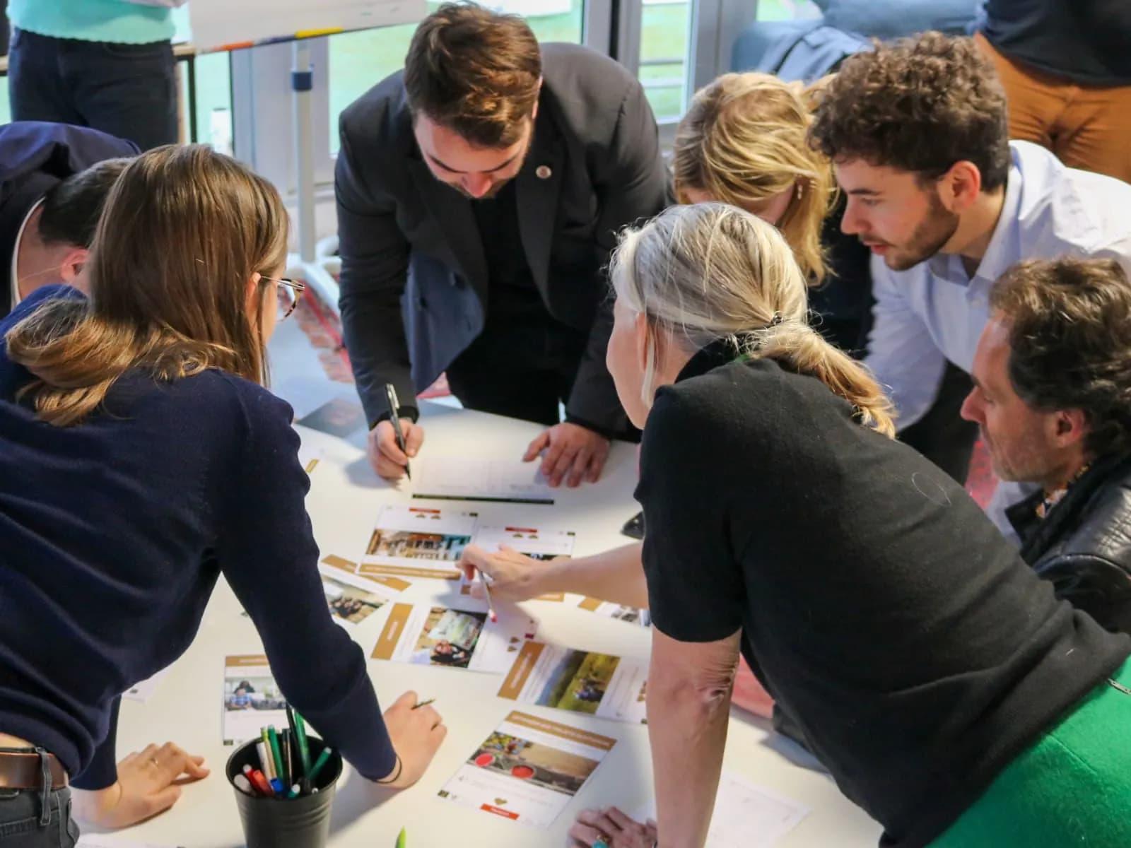 Team members working together during a team building session