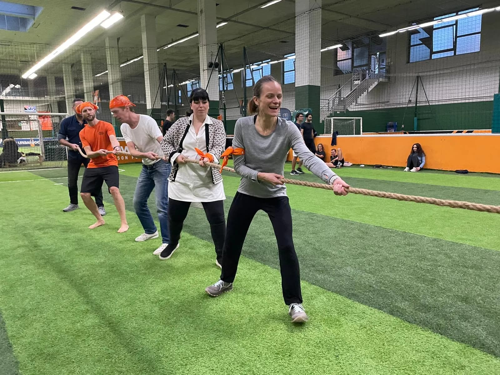 Team playing a sports challenge during indoor team olympics in Paris
