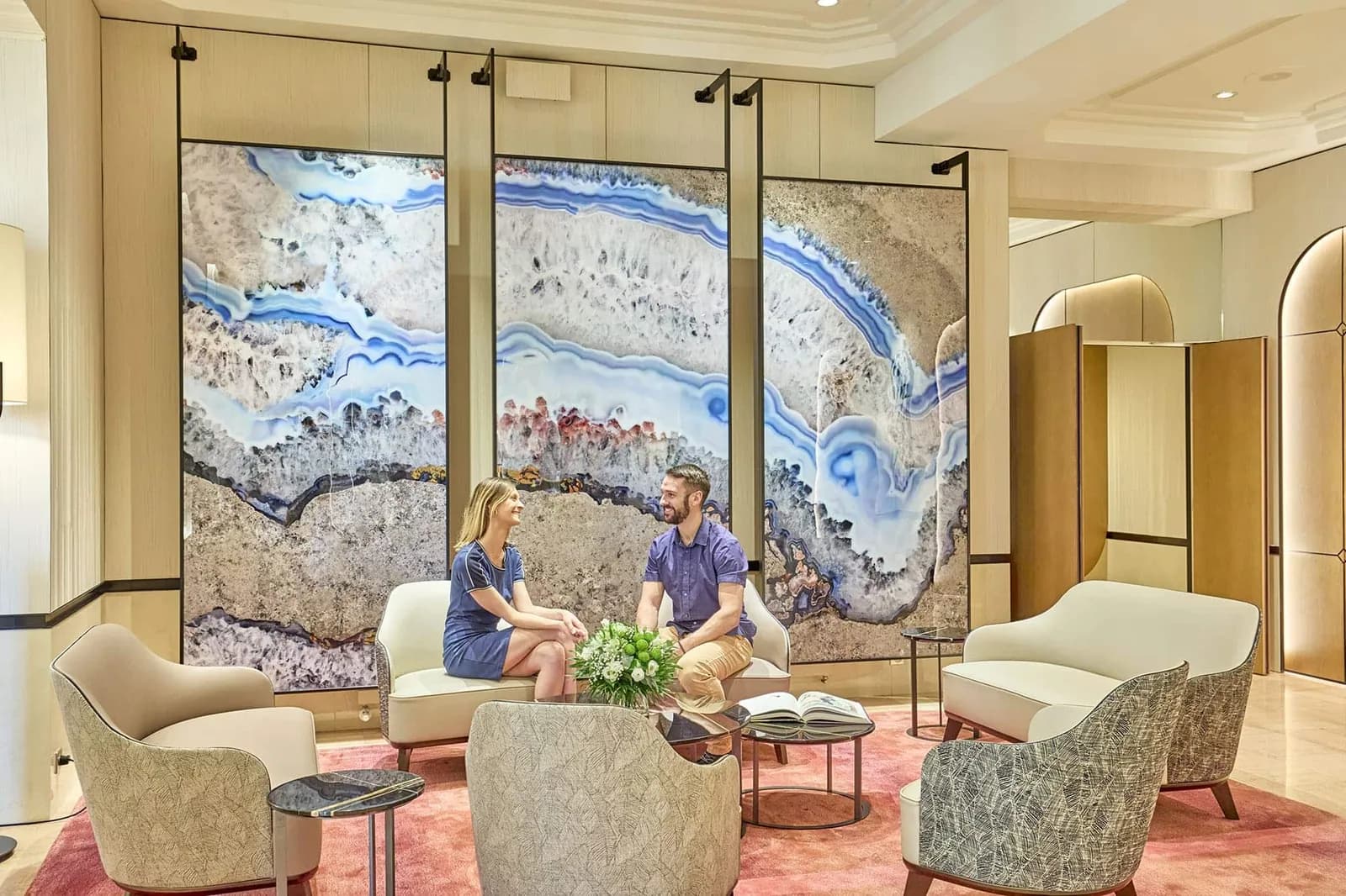 Lobby of Le Grand Hôtel des Thermes with large abstract wall panels, Saint-Malo seafront hotel