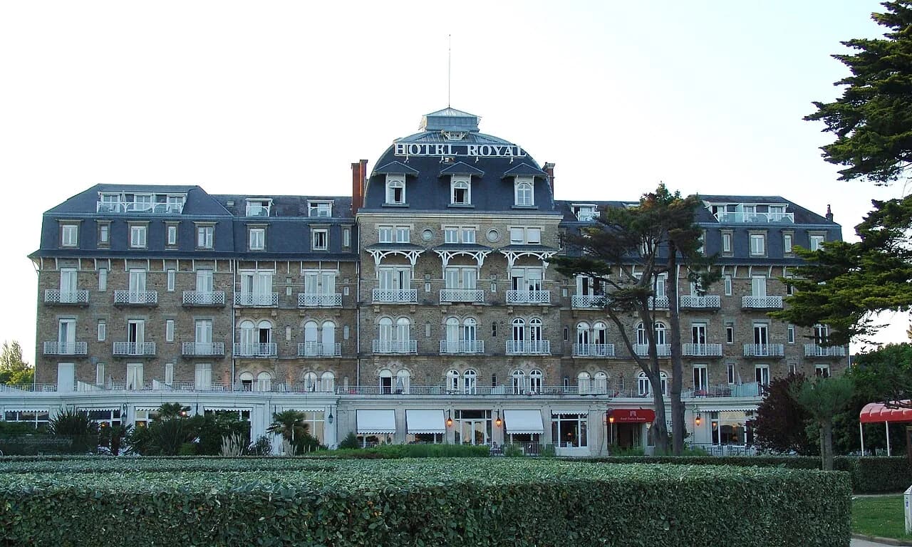 Façade of Hôtel Barrière Le Royal in La Baule, a grand seafront hotel with a slate mansard roof