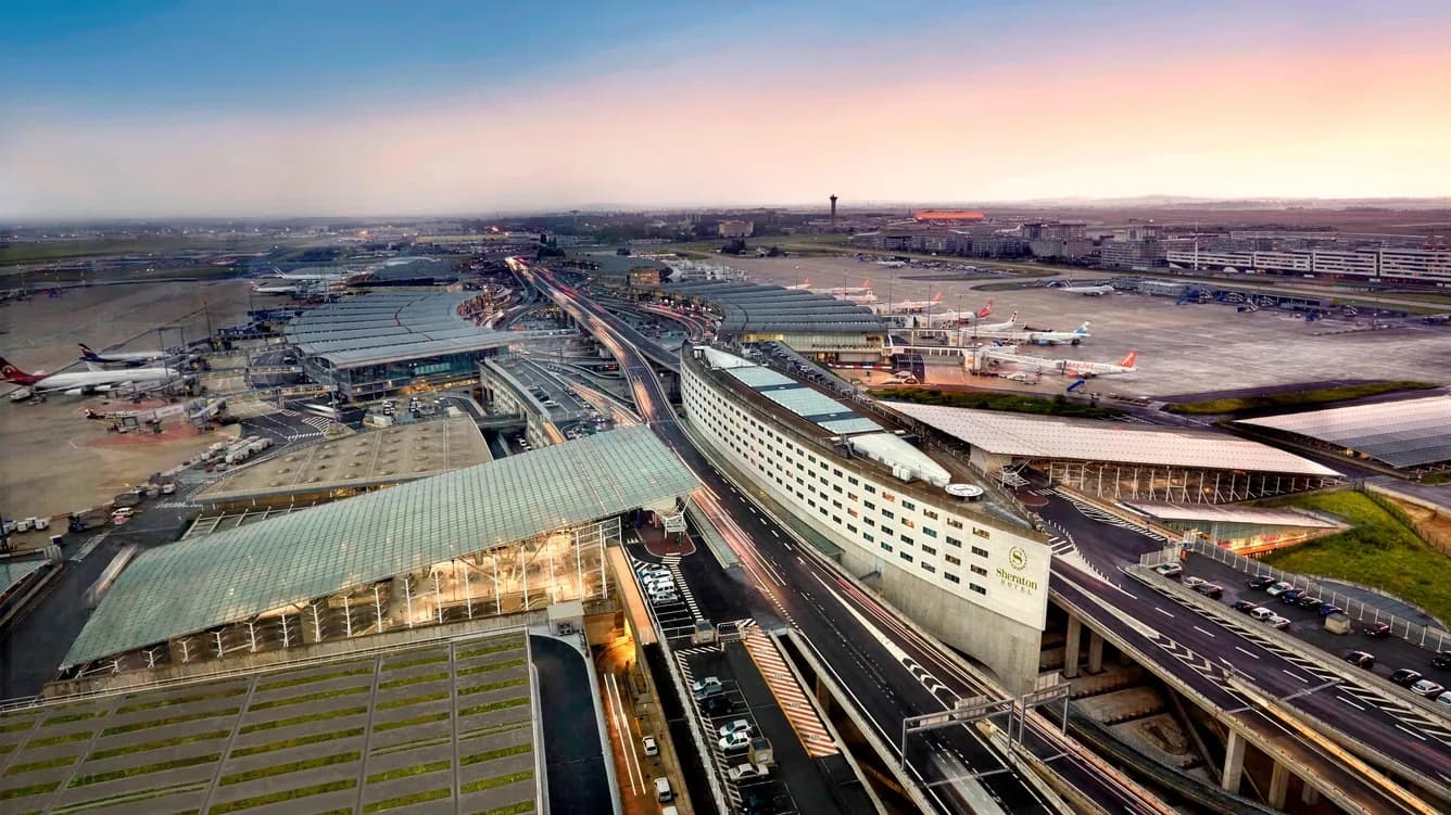 Aerial view of Sheraton Paris Airport Hotel beside the Charles de Gaulle terminals and runways