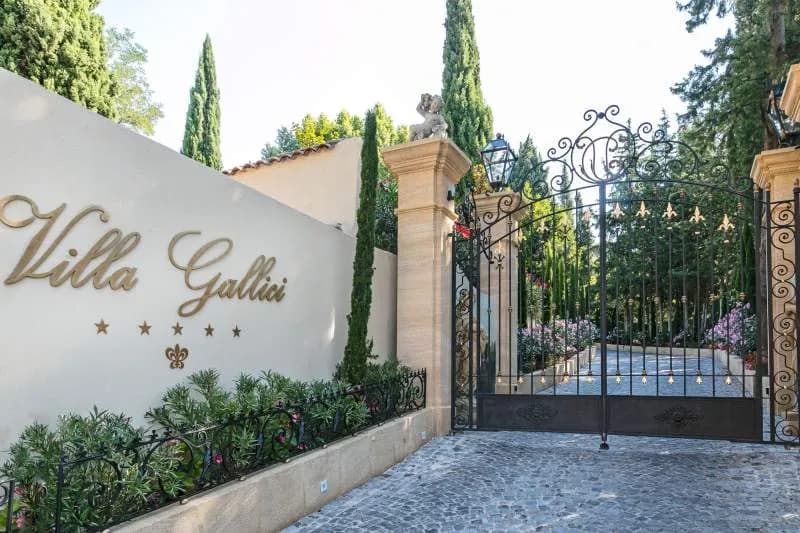 Wrought-iron gates and stone wall bearing the Villa Gallici name in Aix-en-Provence