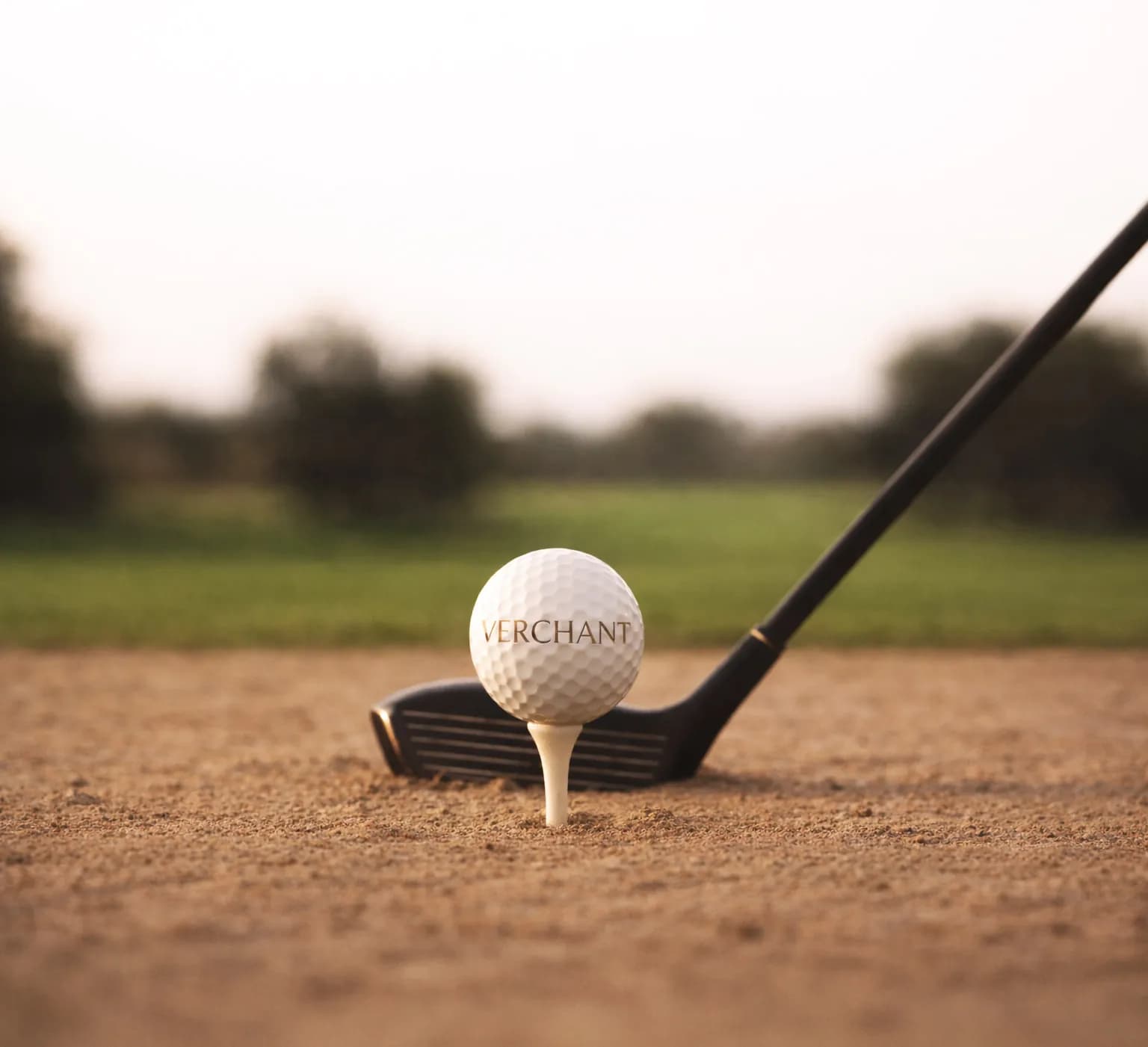 Golf ball on a tee with a driver on the course of Domaine de Verchant, near Montpellier