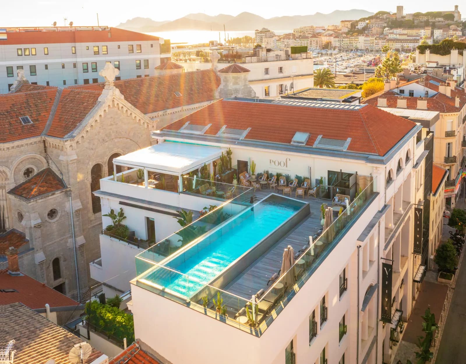 Rooftop pool and terraces of Five Seas Hotel Cannes overlooking the old town and rooftops