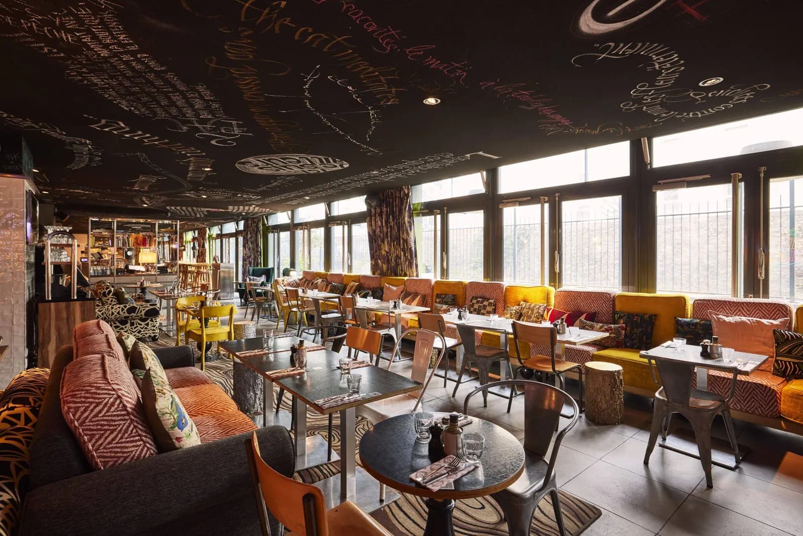 Lounge bar with a graffiti-covered ceiling at the Mama Shelter Paris East hotel, Paris 20e