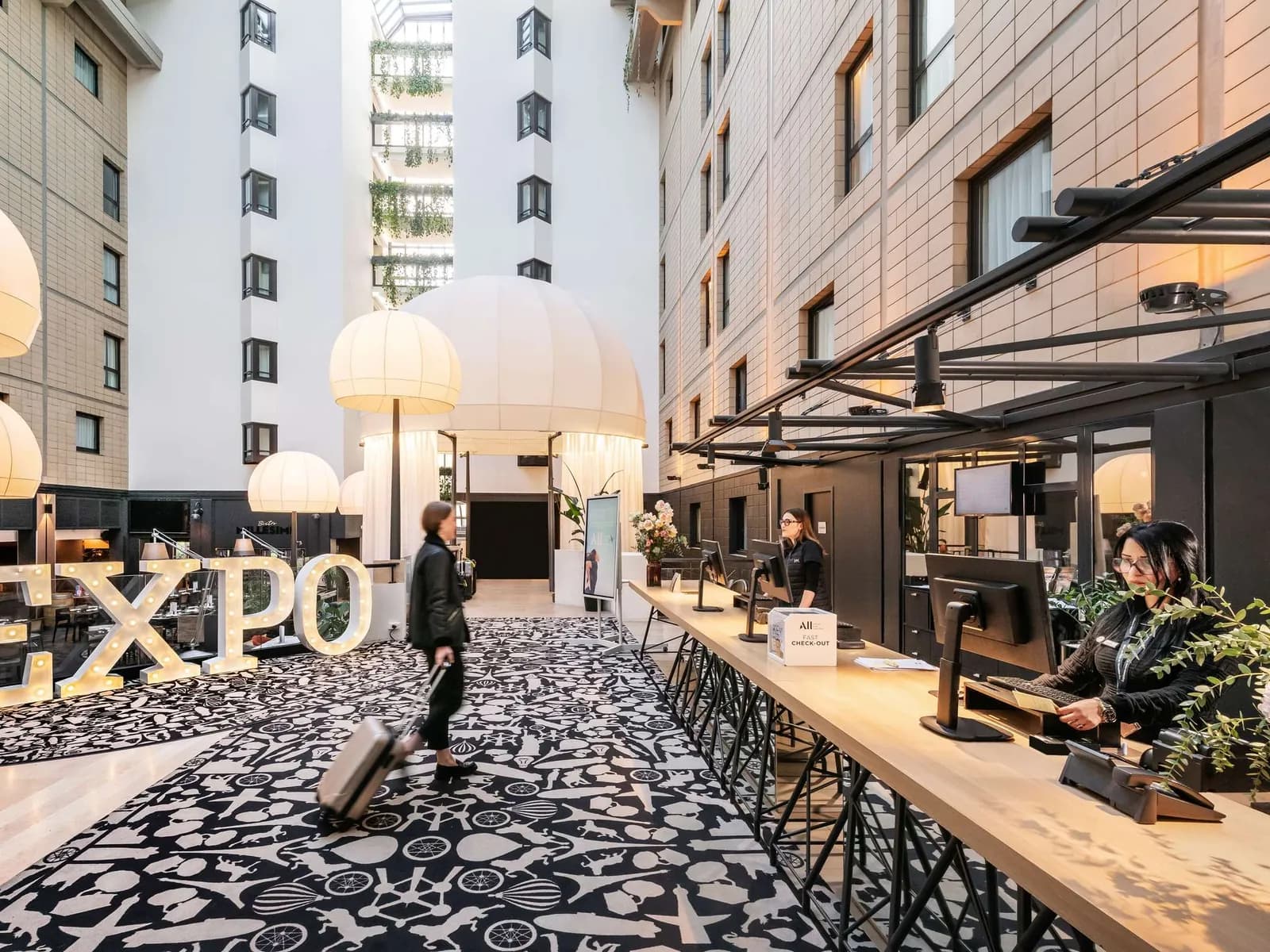 Lobby bar and seating in a bright courtyard at Mercure Paris Porte de Versailles Expo, Vanves