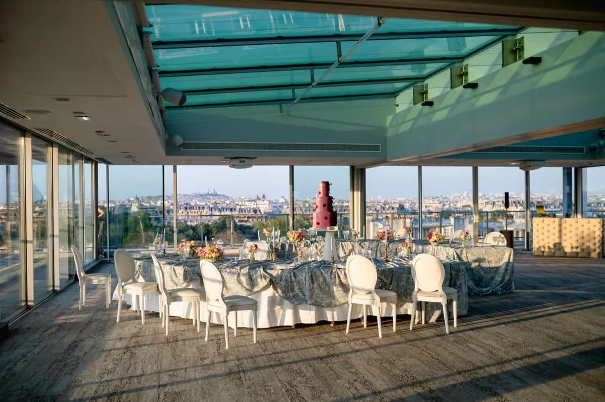 Rooftop salon of the Pullman Paris Tour Eiffel set for a dinner, with a panoramic view over the city