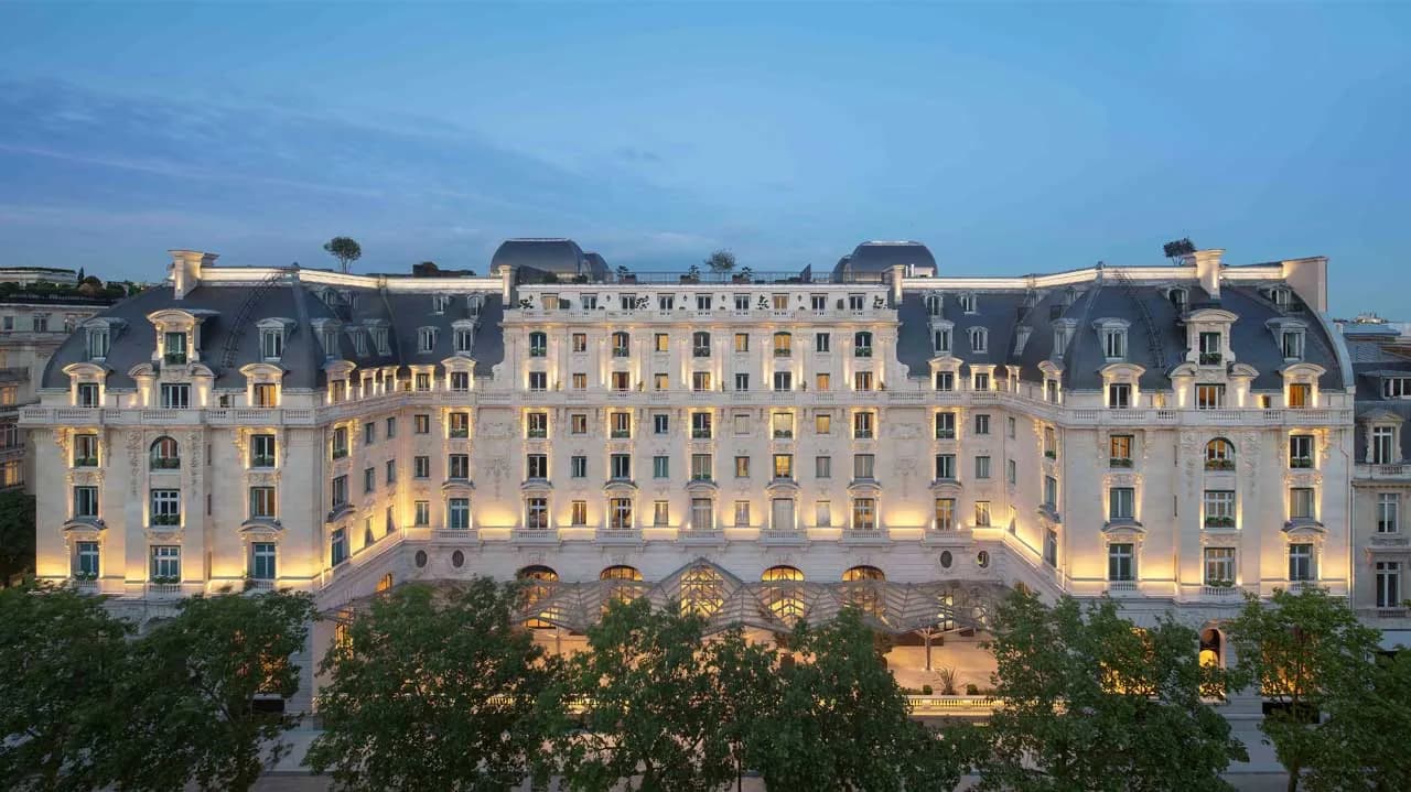 Exterior of The Peninsula Paris on avenue Kléber at dusk, a Haussmann-style palace in the 16th arrondissement