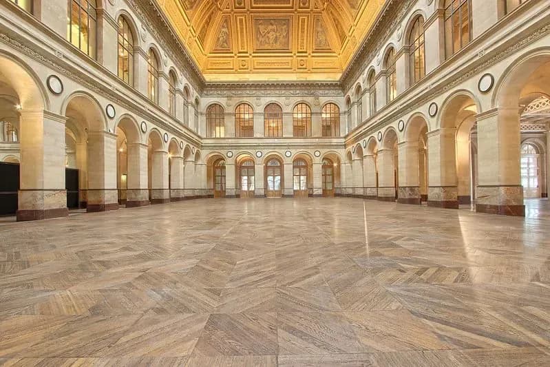 Marble hall with arcaded walls and a richly decorated ceiling