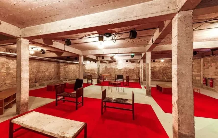 Industrial underground space with exposed concrete beams, Montreuil
