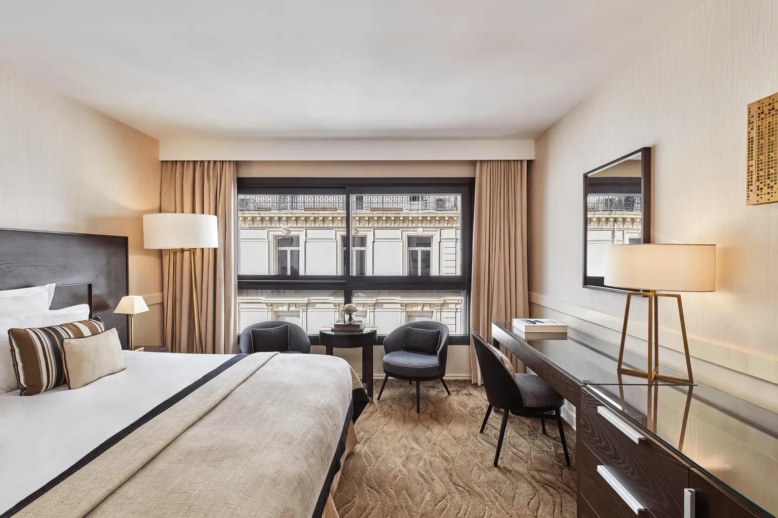 Superior room with city view, king bed and writing desk at Hôtel Barrière Le Gray d'Albion