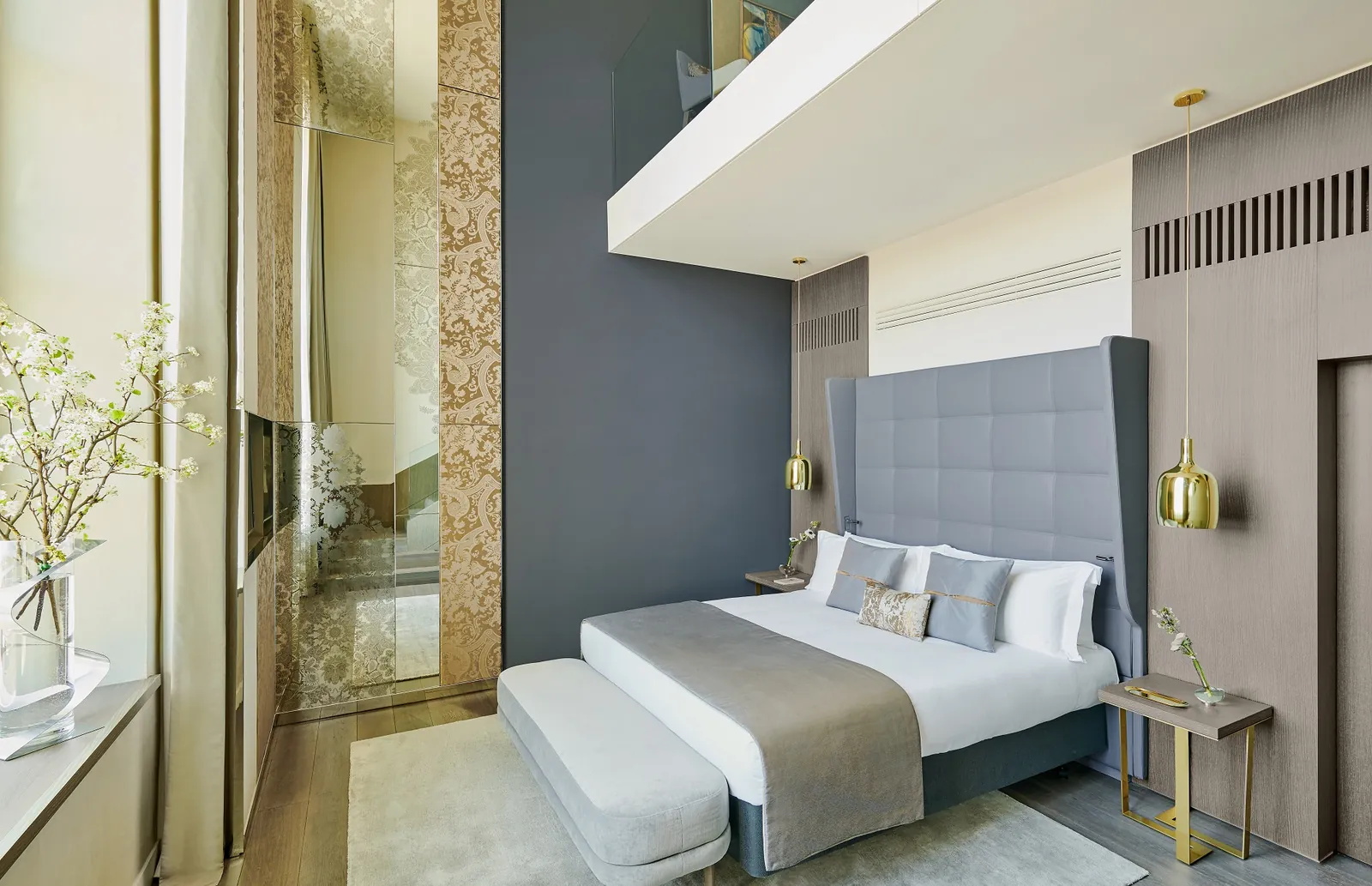 Duplex suite bedroom with grey upholstered headboard at InterContinental Lyon Hôtel-Dieu