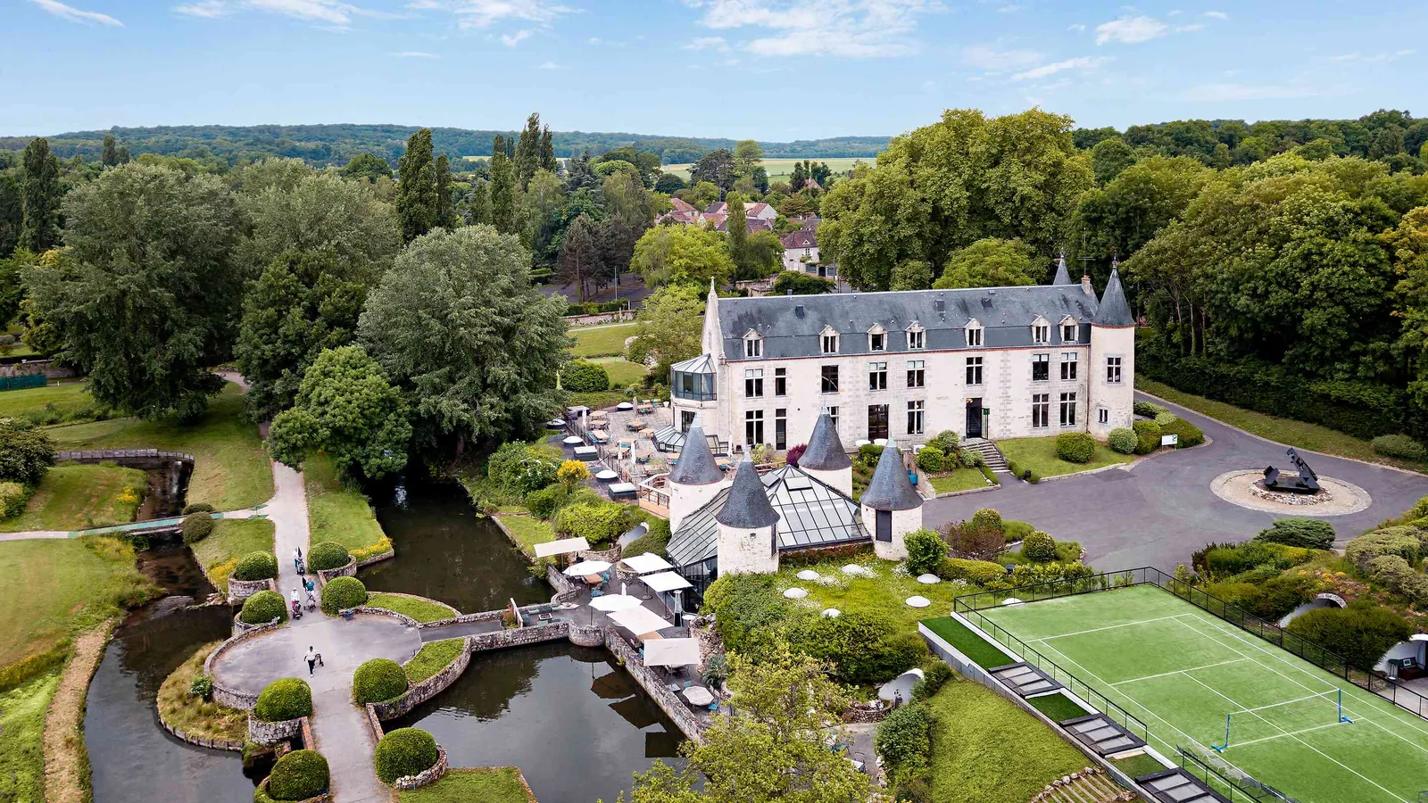 Aerial view of Les Lisières du Gâtinais with its sports pitch, lawns and wooded grounds south-east of Paris