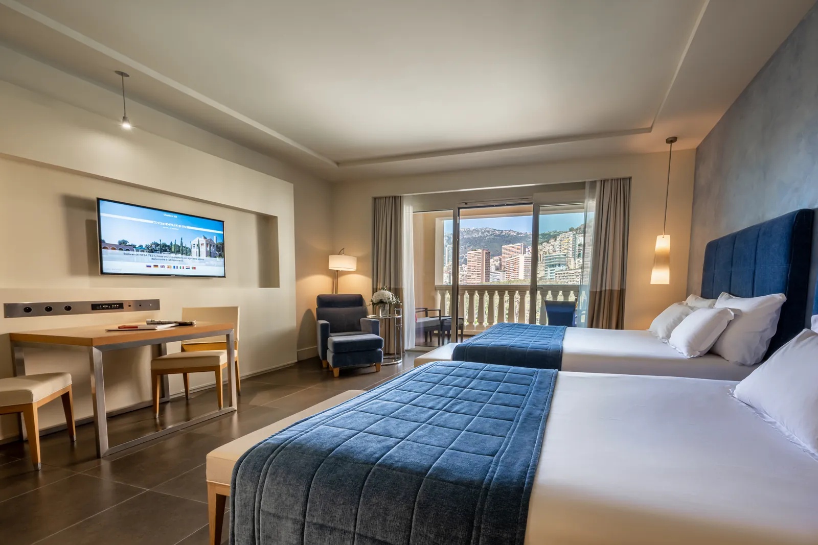 Twin deluxe room with sea view, desk and balcony at Monte-Carlo Bay Hotel & Resort, Monaco