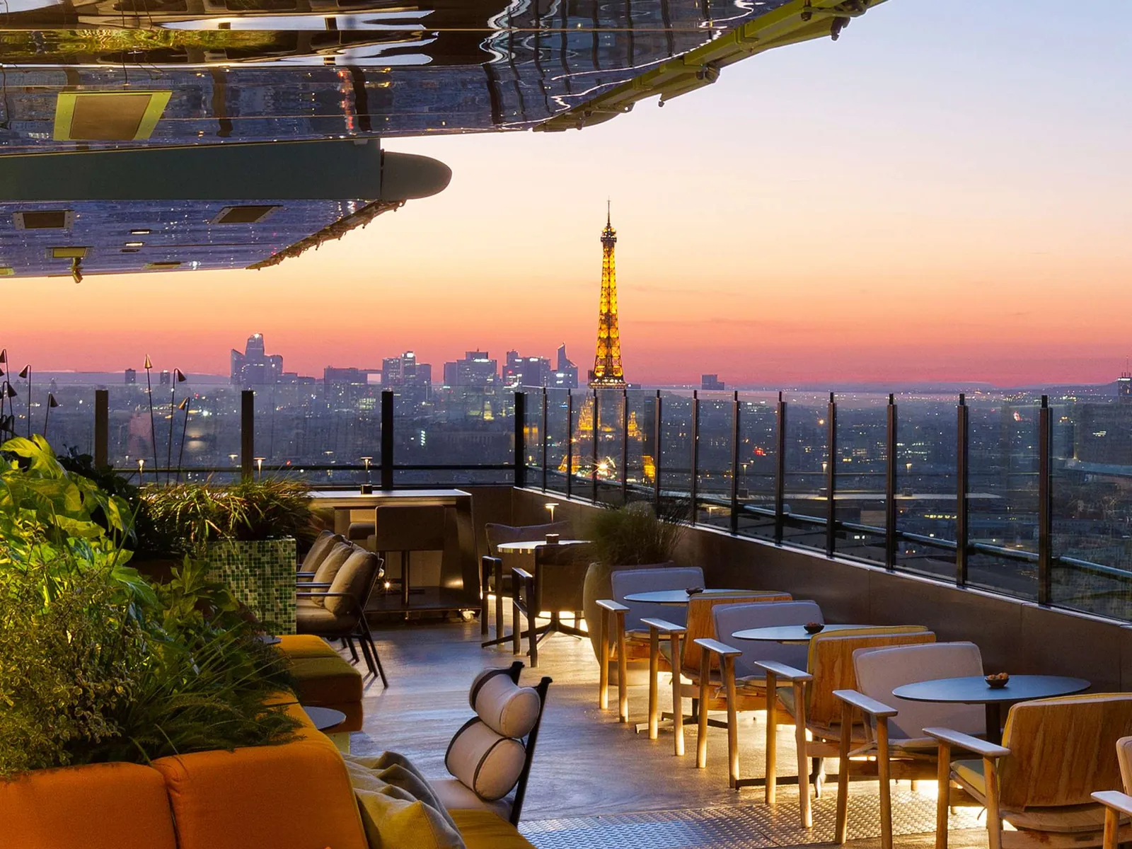 Rooftop bar at sunset with the Eiffel Tower in view at Pullman Paris Montparnasse, Paris