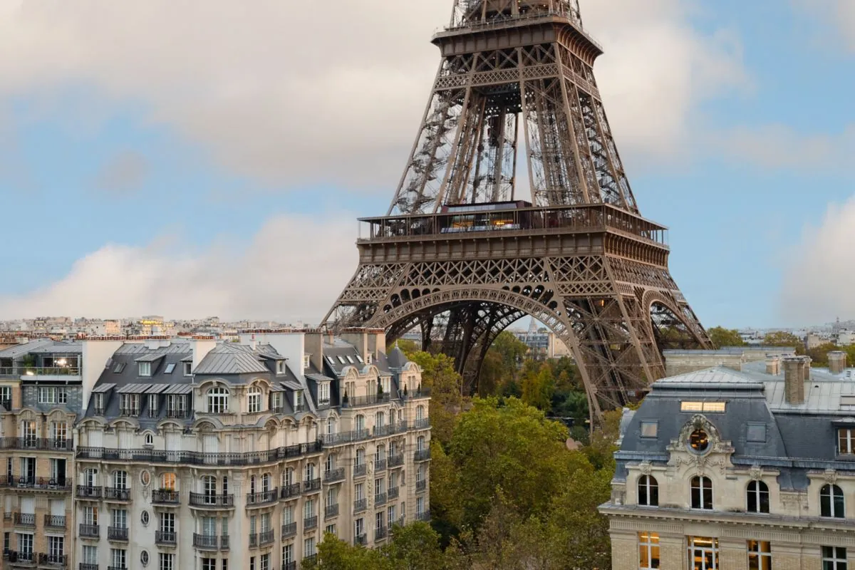 View of the Eiffel Tower framed by classic Haussmann facades from the Pullman Paris Tour Eiffel