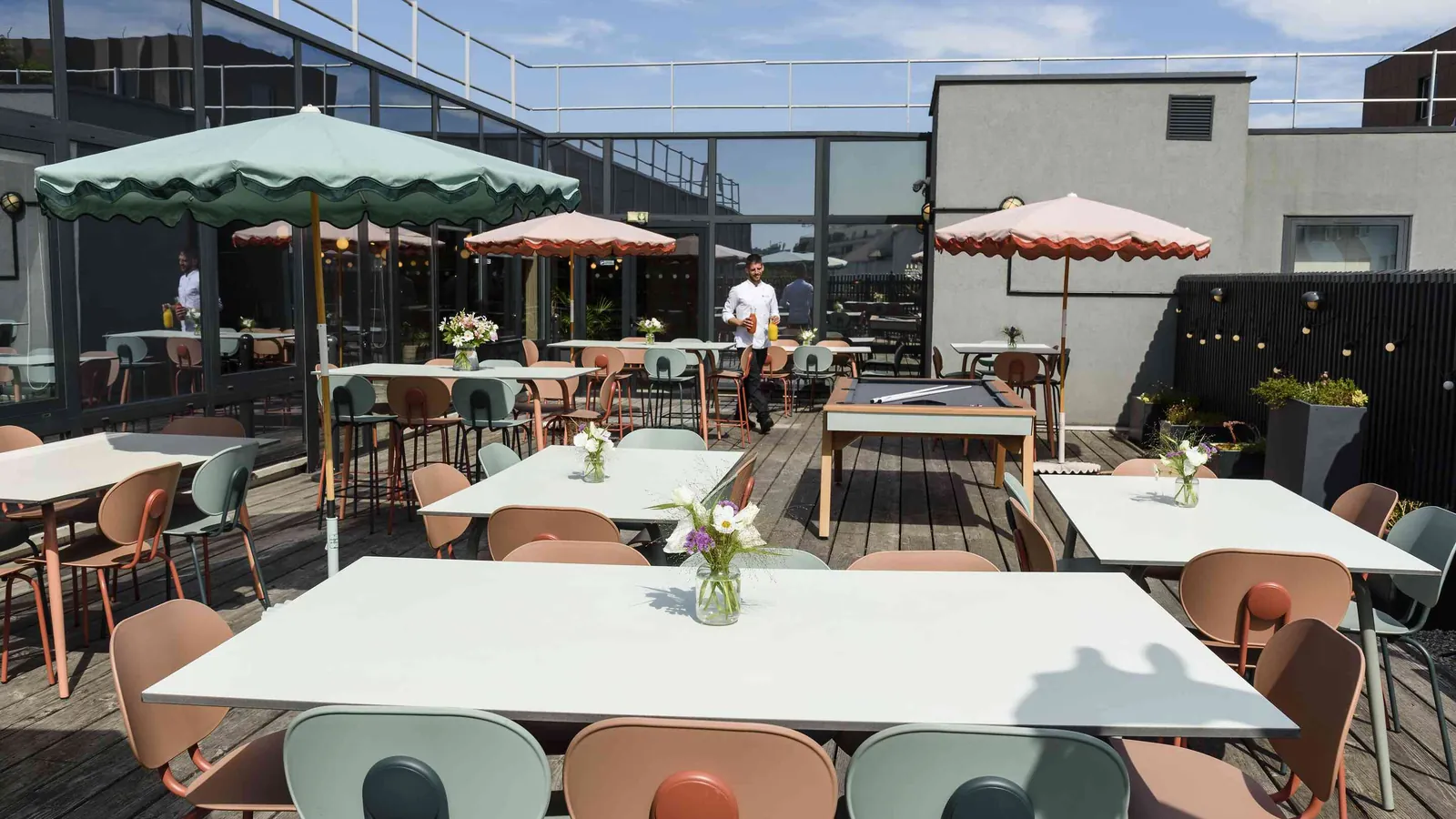 North Belvedere rooftop terrace with parasols, tables and chairs set for a reception