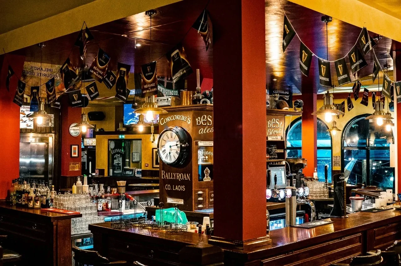 Bar counter with pennant flags and warm lighting
