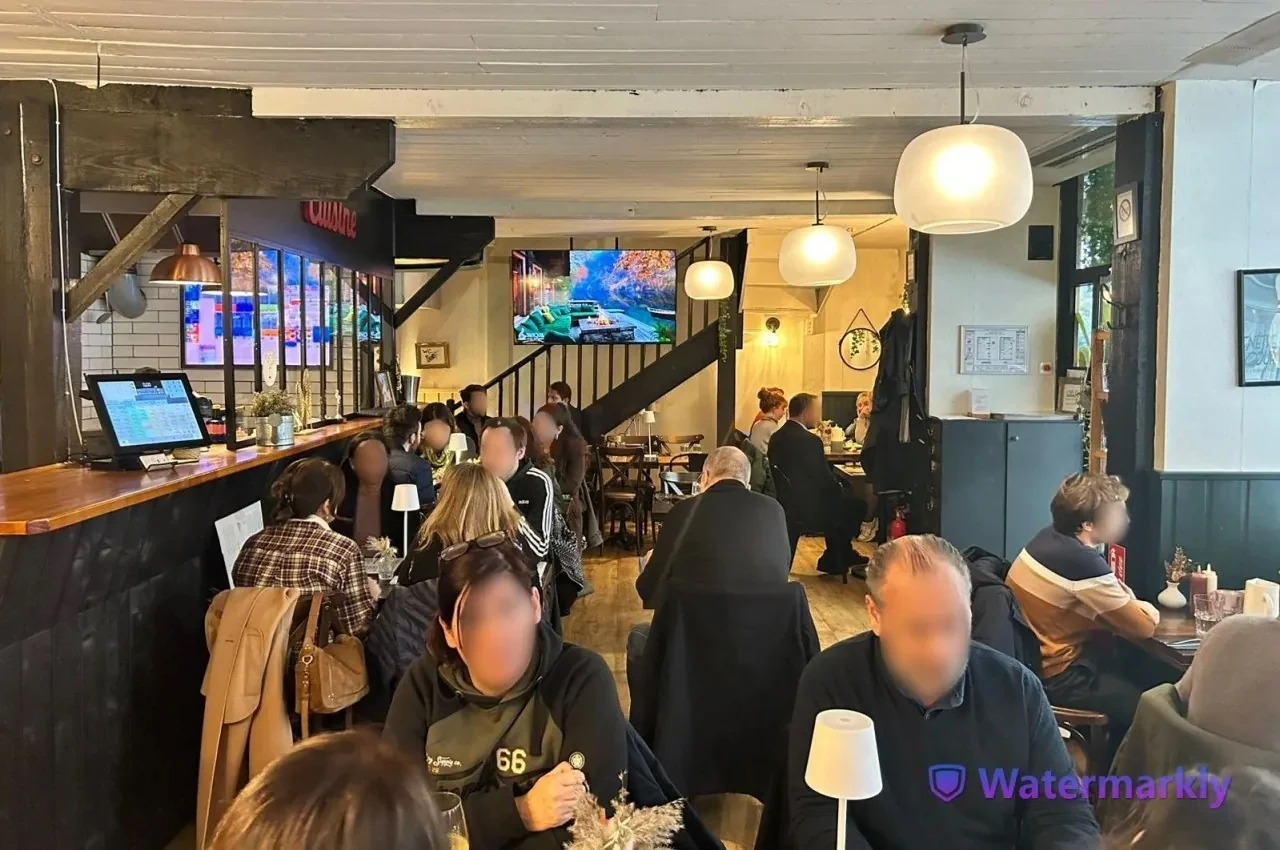 Bar area with high tables and seated guests