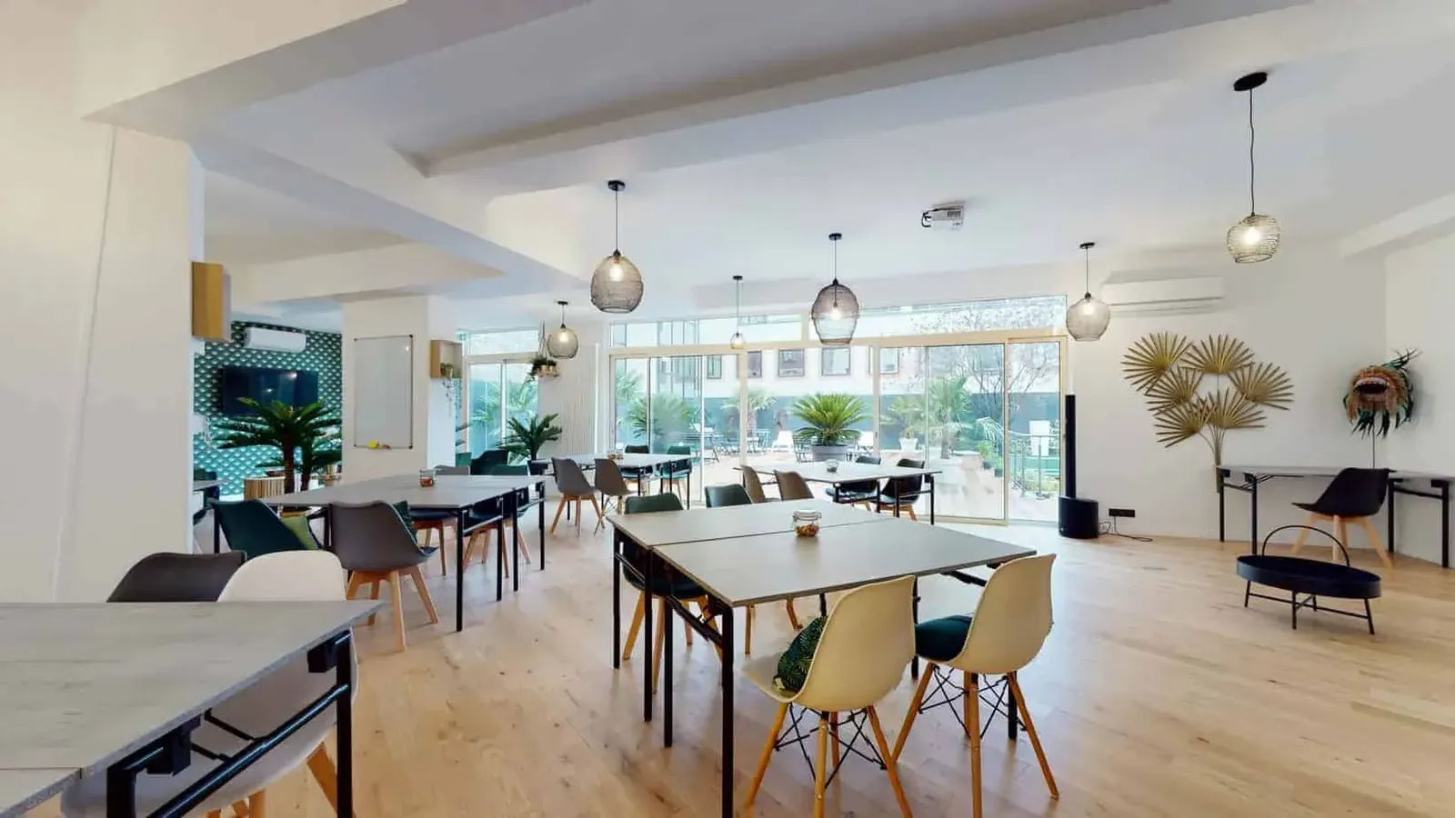 Jungle-style interior opening onto a terrace