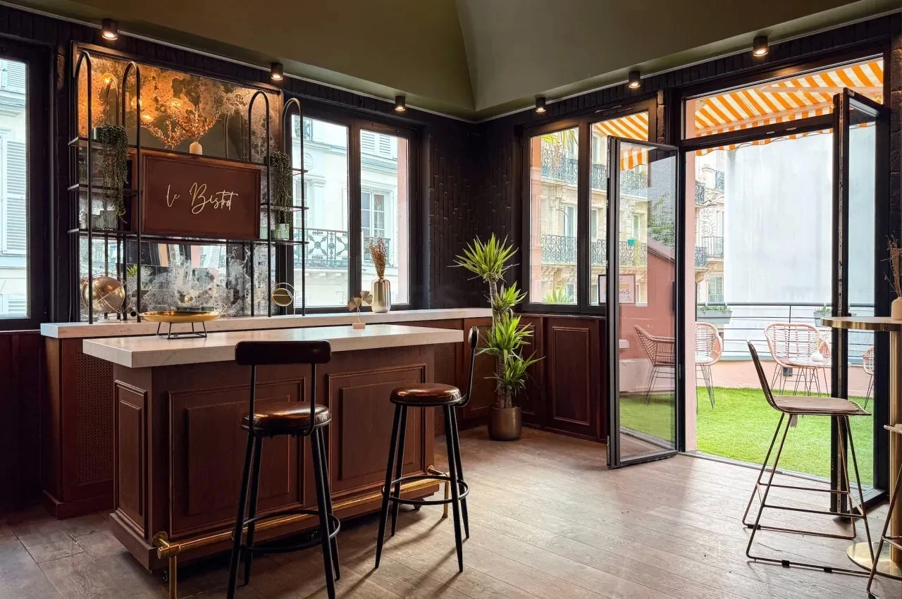 Bistro bar with a terrace opening onto greenery