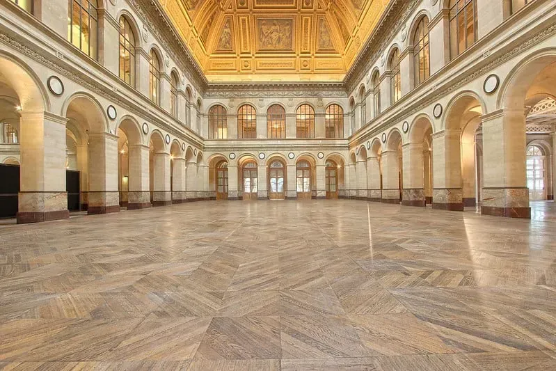 Marble hall with arcaded walls and a richly decorated ceiling