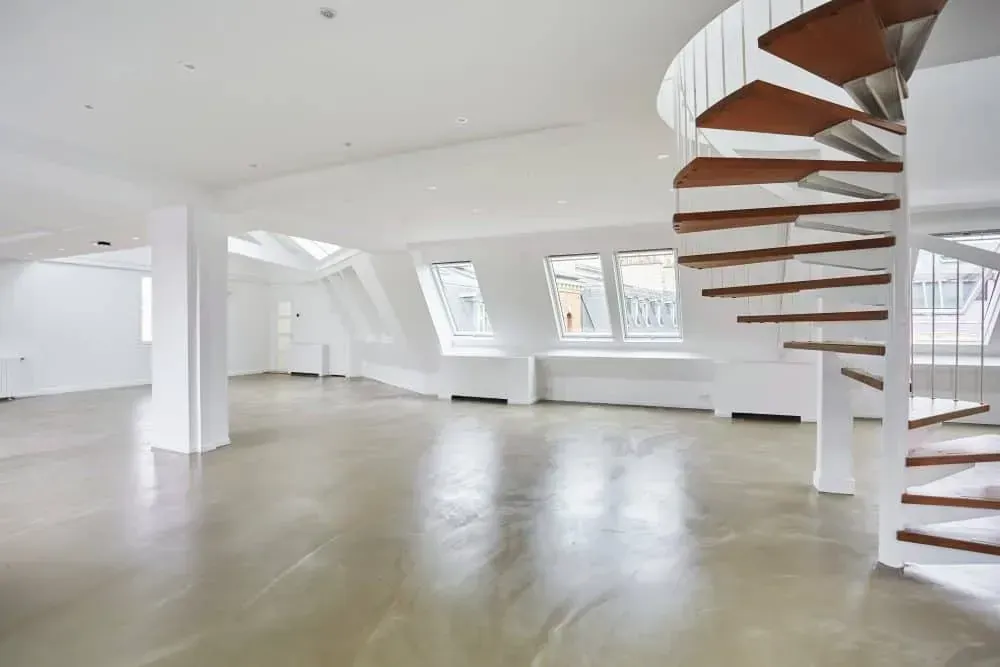 Loft with a spiral staircase and a wooden terrace