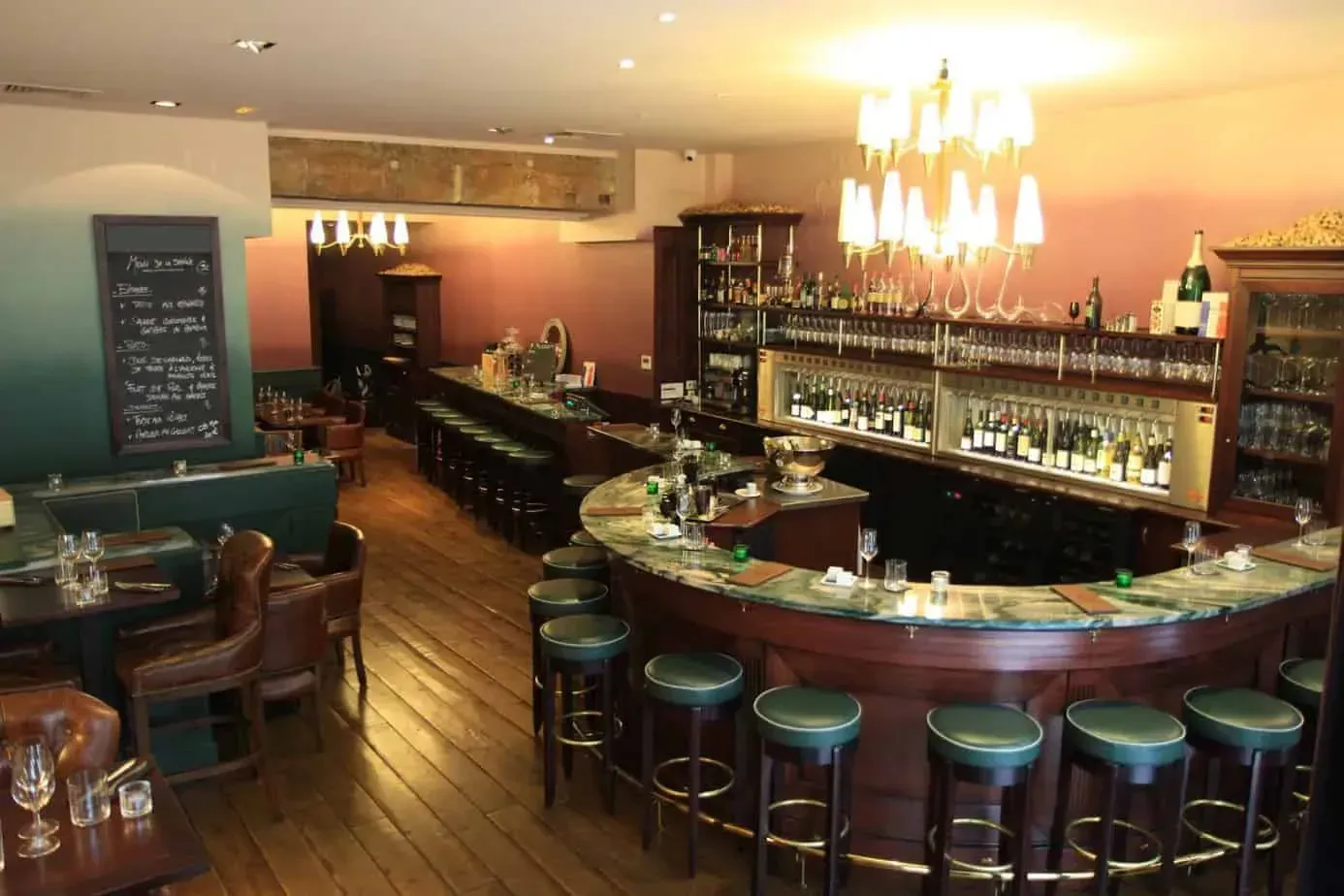 The same bar from another angle, with wine shelves behind the counter